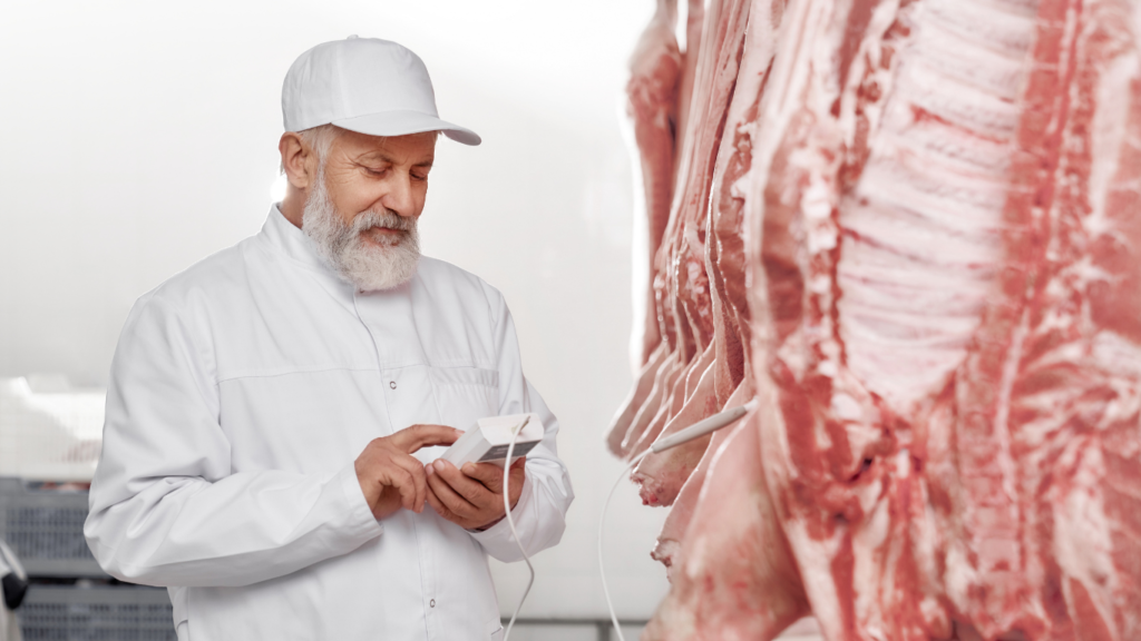 Fresh premium-quality mutton cuts neatly displayed on a wooden board, ready for cooking.